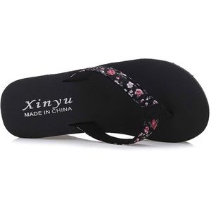 NWT- Xinya flip flops- size 40- US 7.5 . Floral strap pattern with black soles..